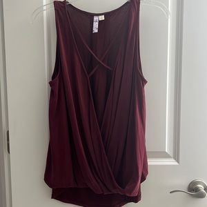 Woman’s small burgundy drape crisscross tank top bought at Francesca’s.